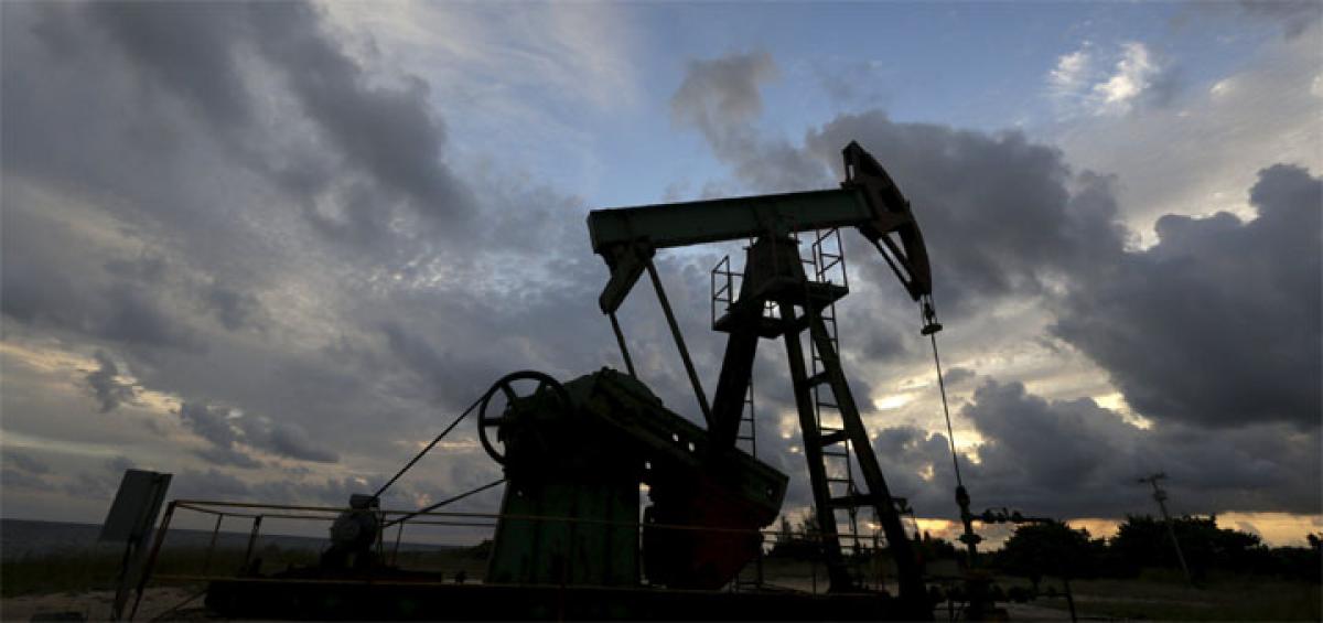 Oil prices up on France IS strikes, US stockpiles data